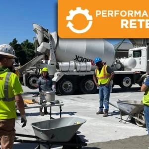 Concrete certification candidates completing a hands-on performance retest at an ACI Carolinas field testing event with a ready-mix concrete truck.