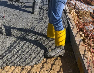 Student gaining hands-on experience finishing concrete, representing ACI Carolinas Student Membership.